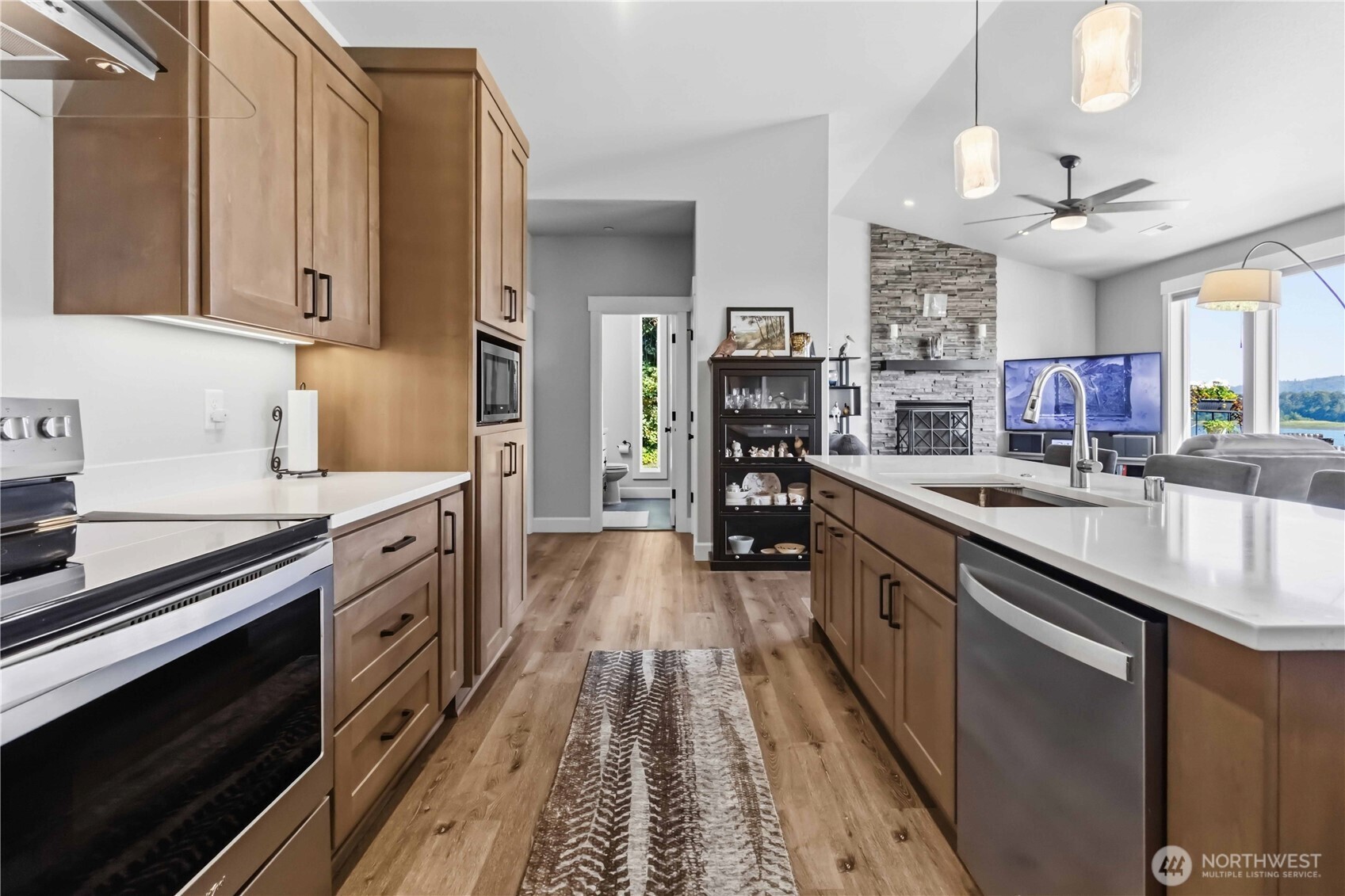 119 Old Mill Creek Road Longview, WA 98632 - Photo 11 of 40 a kitchen with stainless steel appliances sink stove refrigerator and cabinets