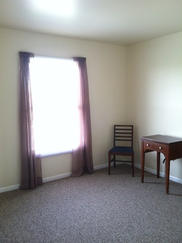 125 Cobblestone Court DeKalb, IL 60115 - Photo 18 of 25 a view of room with windows and chair