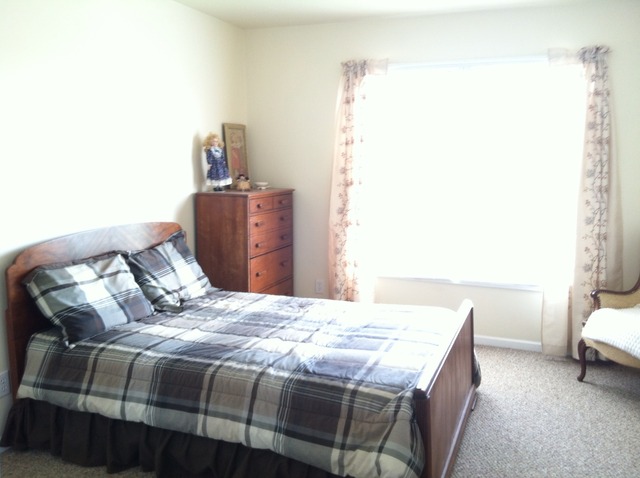125 Cobblestone Court DeKalb, IL 60115 - Photo 20 of 25 a bedroom with a bed and a chair