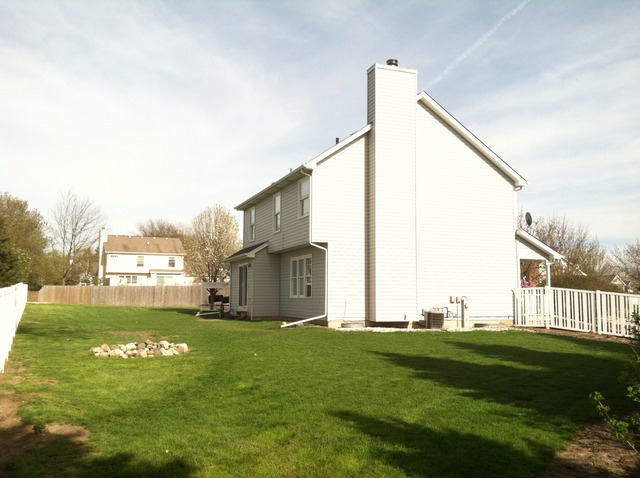 125 Cobblestone Court DeKalb, IL 60115 - Photo 25 of 25 a view of a garden with a house