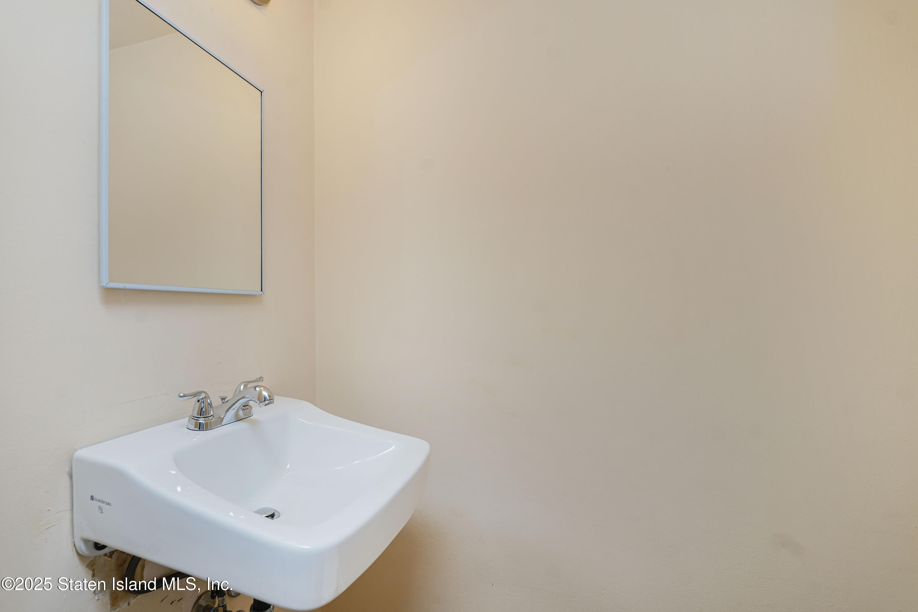 80 Gold Avenue Staten Island, NY 10312 - Photo 11 of 33 a white bathroom with a sink