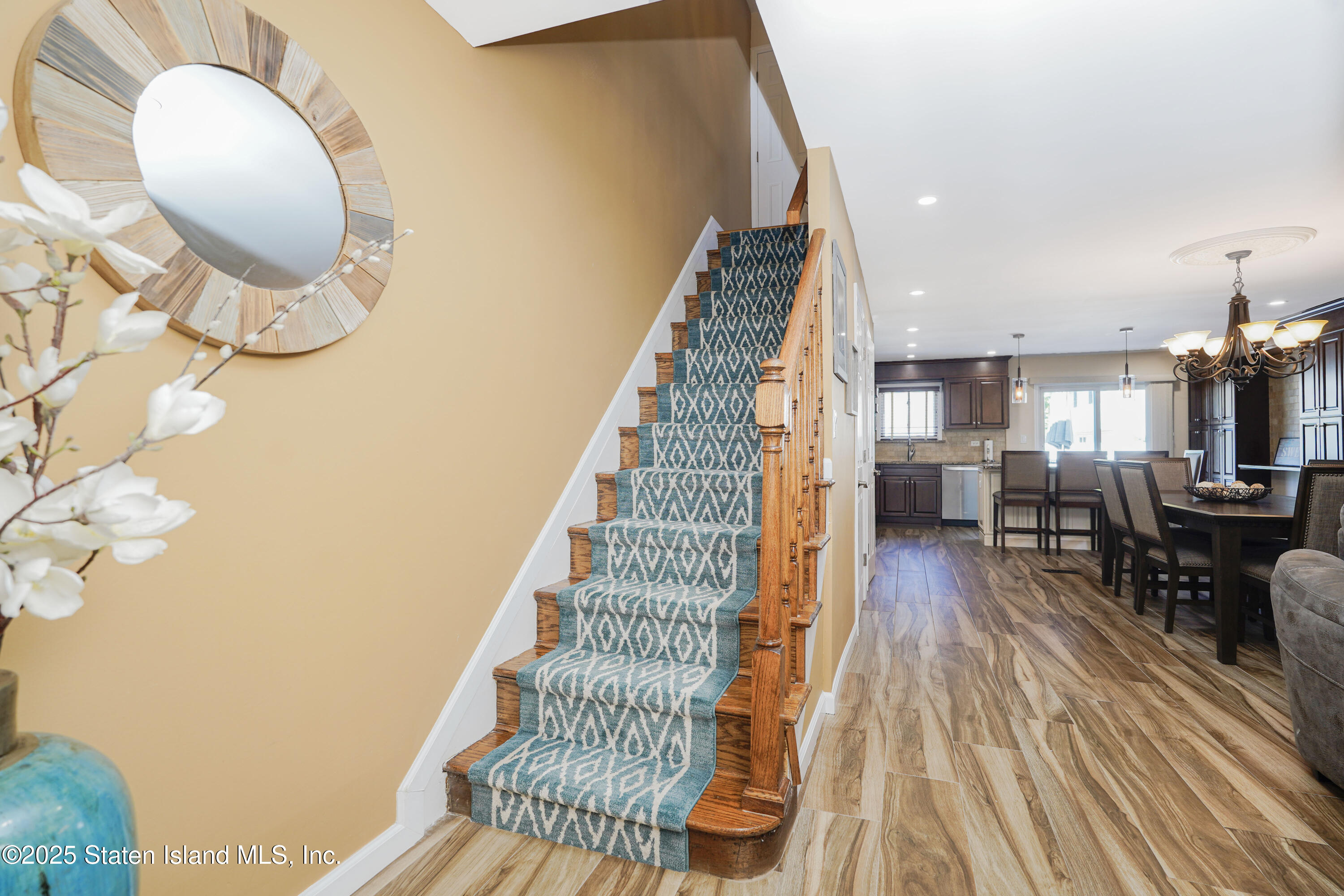 80 Gold Avenue Staten Island, NY 10312 - Photo 12 of 33 an entryway with wooden floor and staircase