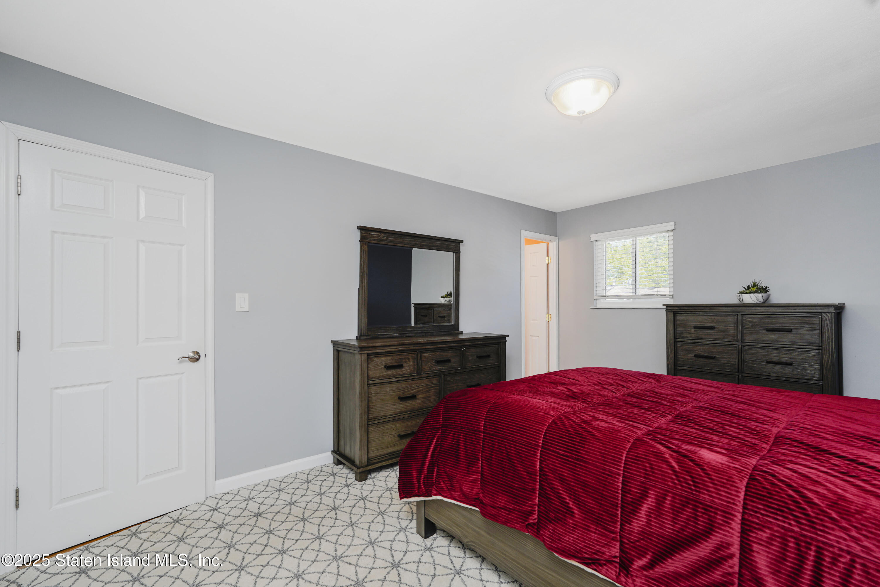 80 Gold Avenue Staten Island, NY 10312 - Photo 14 of 33 a bed room with a bed and a television