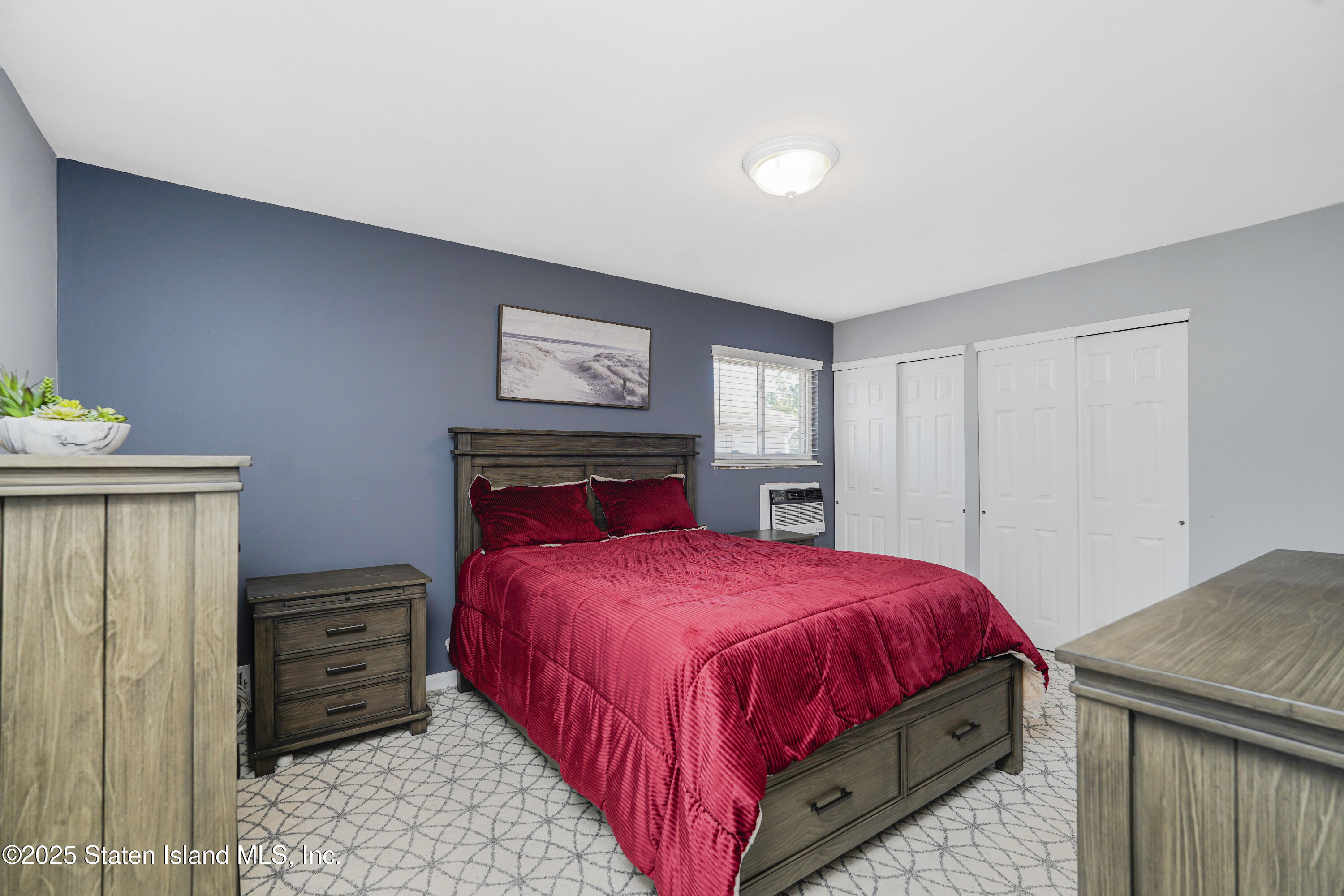 80 Gold Avenue Staten Island, NY 10312 - Photo 15 of 33 a bedroom with a bed and a dresser