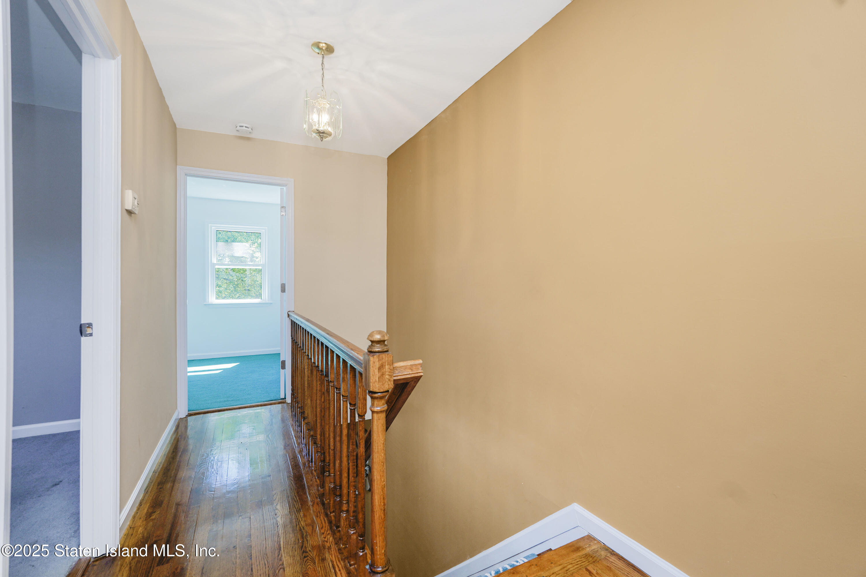 80 Gold Avenue Staten Island, NY 10312 - Photo 17 of 33 a view of hallway with stairs and wooden floor