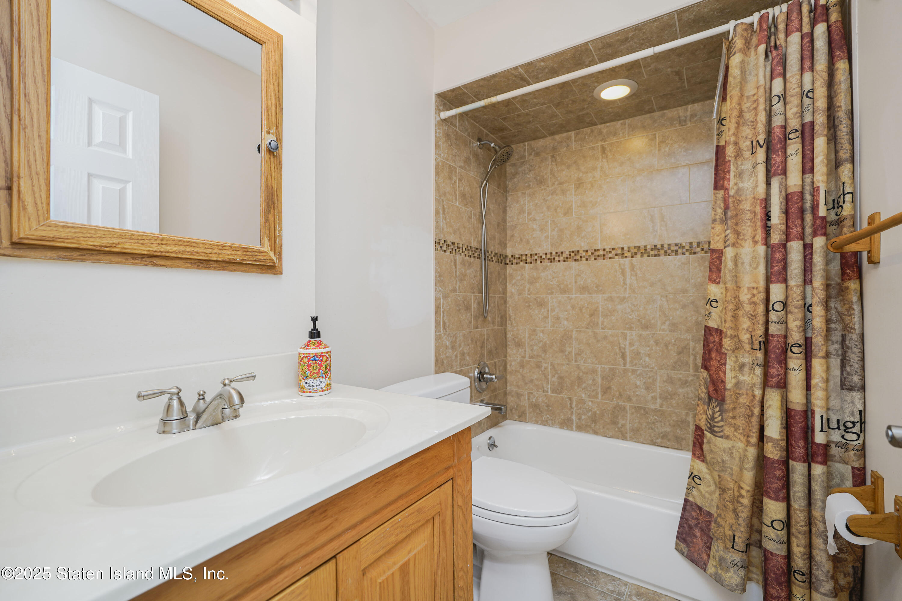 80 Gold Avenue Staten Island, NY 10312 - Photo 18 of 33 a bathroom with a sink toilet and shower
