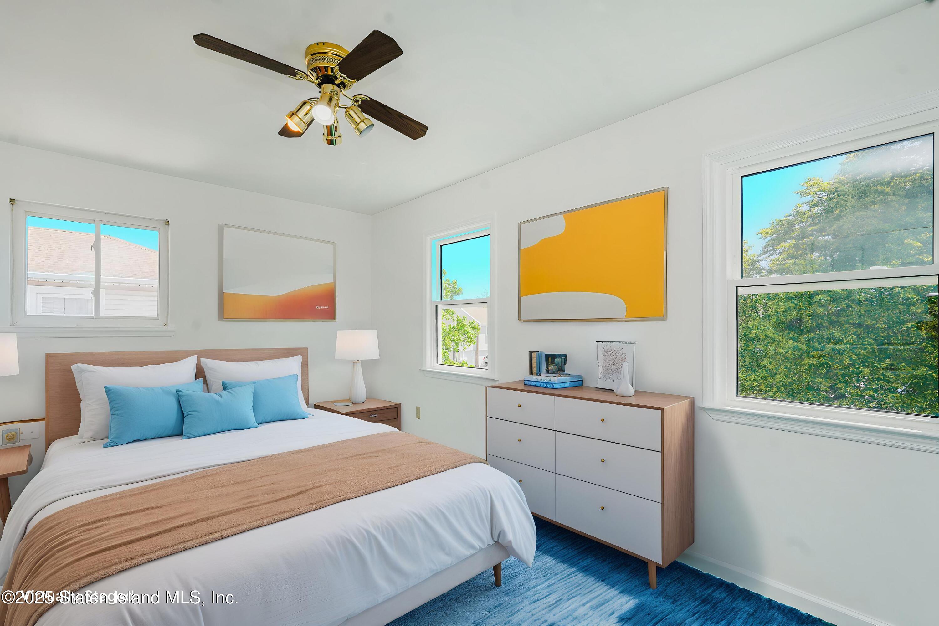 80 Gold Avenue Staten Island, NY 10312 - Photo 22 of 33 a bedroom with a large bed and a window