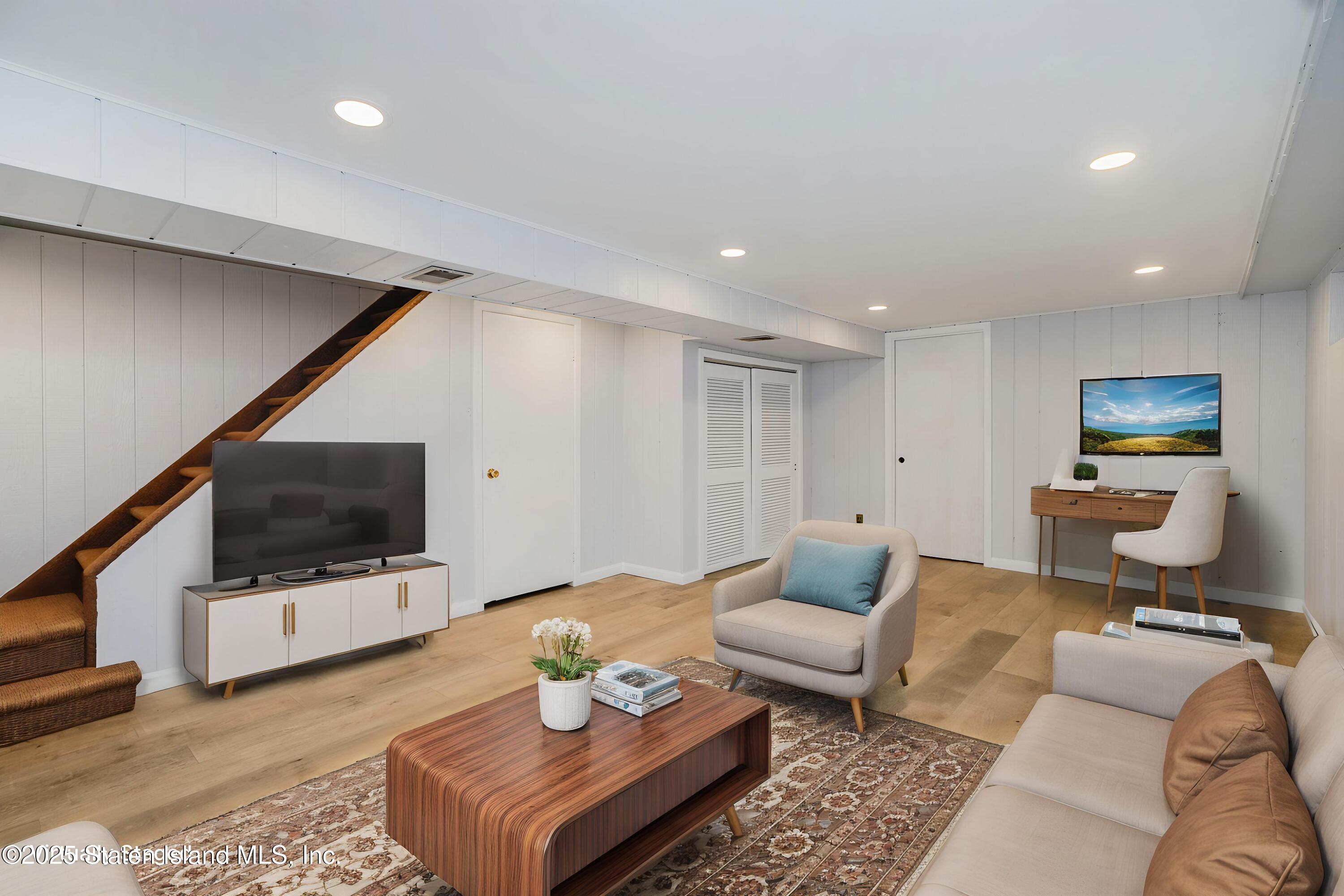 80 Gold Avenue Staten Island, NY 10312 - Photo 25 of 33 a living room with furniture and a flat screen tv