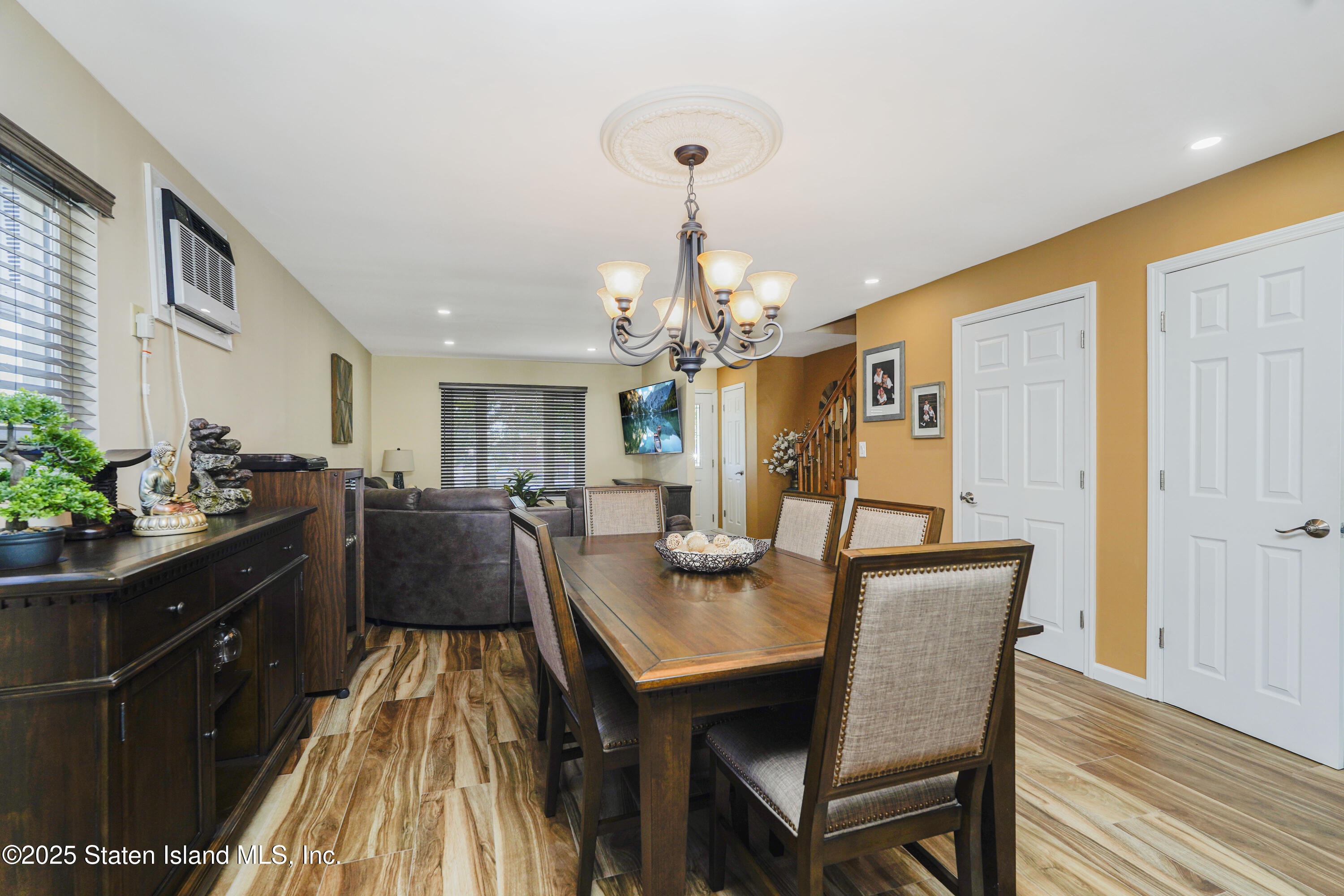 80 Gold Avenue Staten Island, NY 10312 - Photo 9 of 33 a view of a dining room with furniture and wooden floor