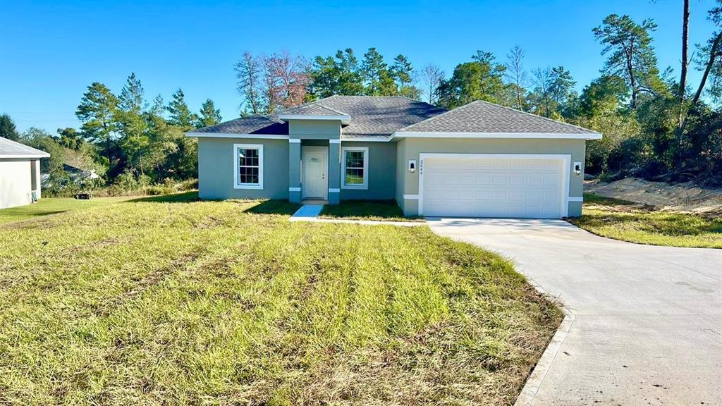 2649 Southwest 146th Pl Road Ocala, FL 34473 - Photo 1 of 1 a view of a house with a yard