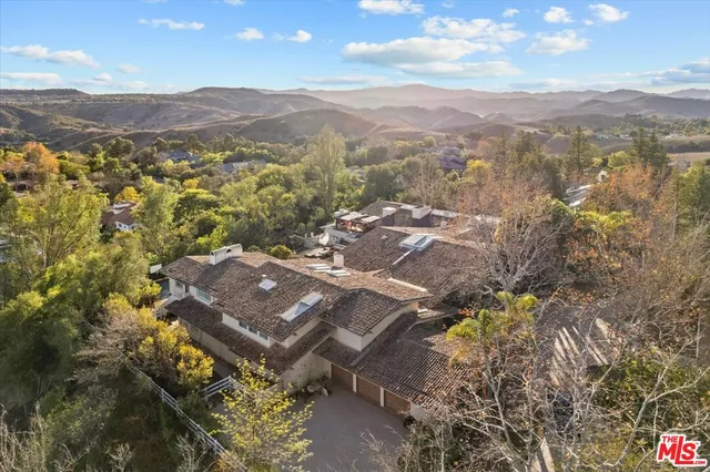 a view of a city with mountains in the background