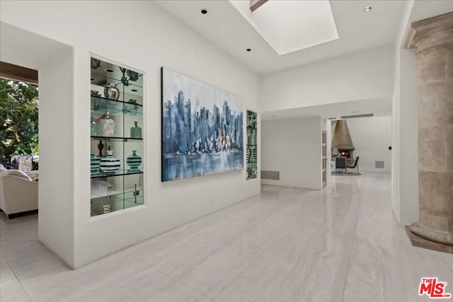 a view of a livingroom with wooden floor and furniture