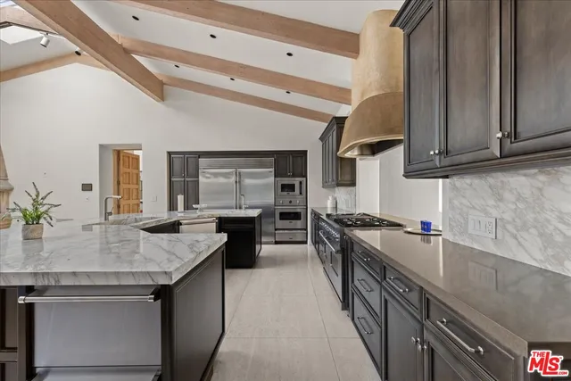 a kitchen with a stove and a sink