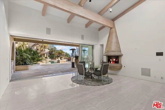 a view of a living room with a floor to ceiling window and floor to ceiling window