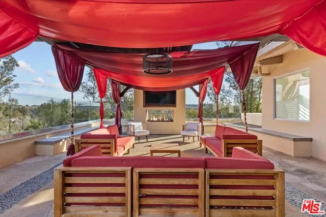 a view of a patio with a table and chairs