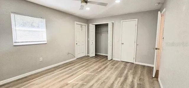 a view of an empty room with a window