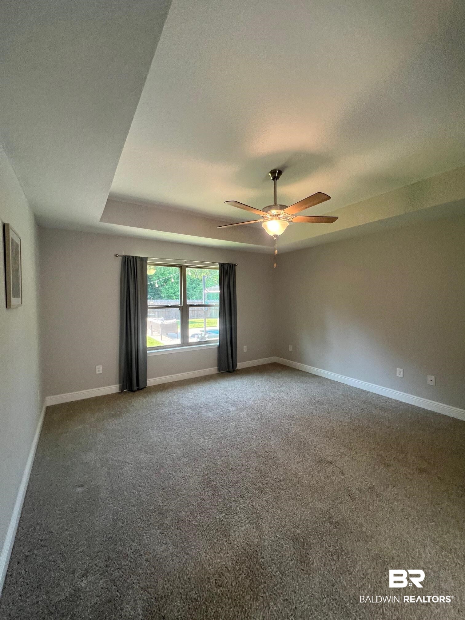 32915 Arbor Ridge Circle Lillian, AL 36549 - Photo 8 of 26 Empty room with carpet and ceiling fan