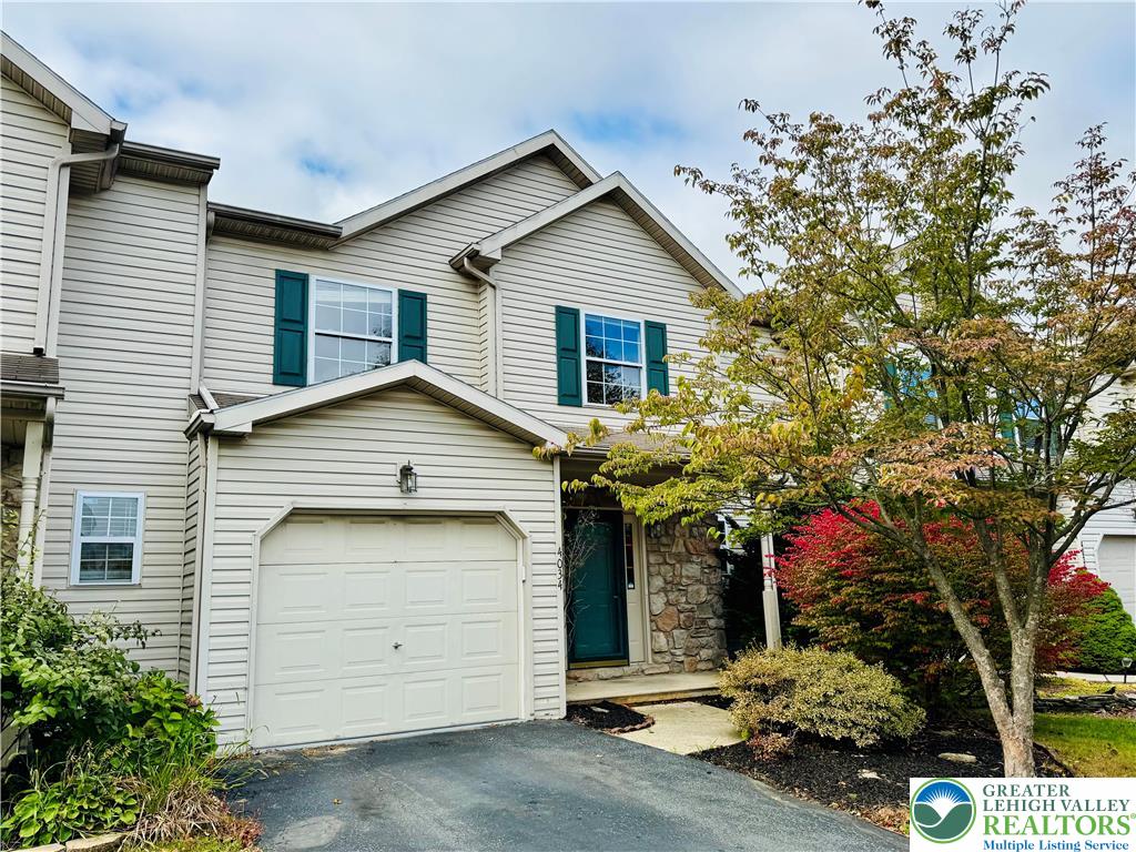 a front view of a house with a garage
