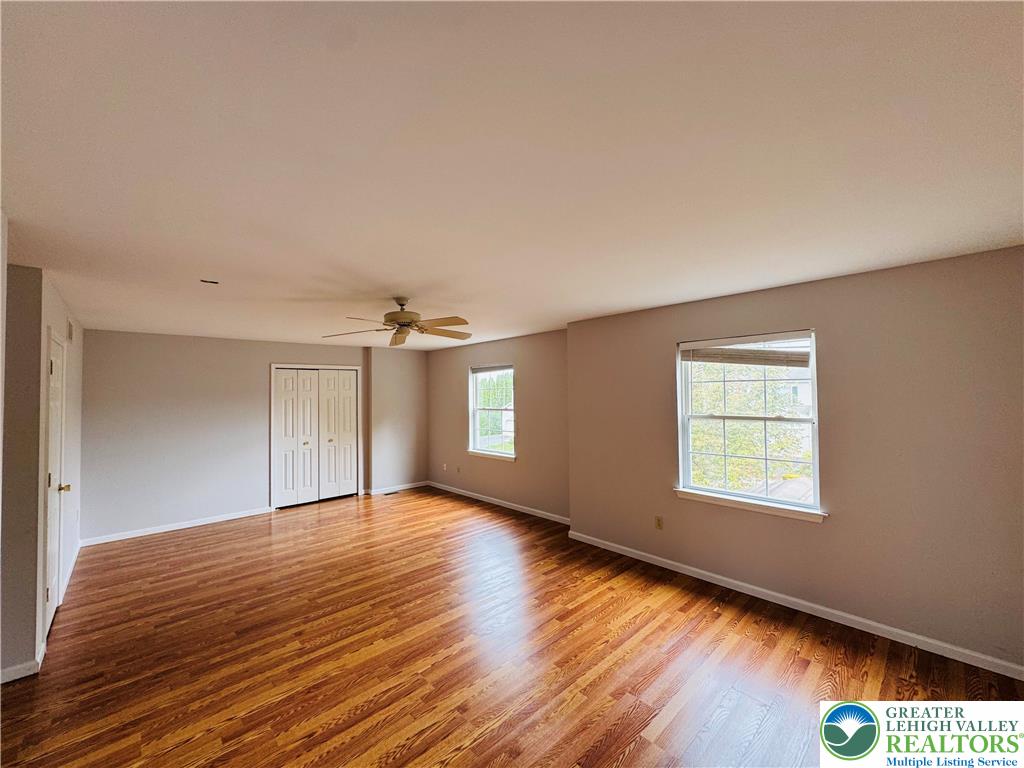4034 Reeve Drive Bethlehem, PA 18020 - Photo 16 of 36 a view of an empty room with wooden floor and a window