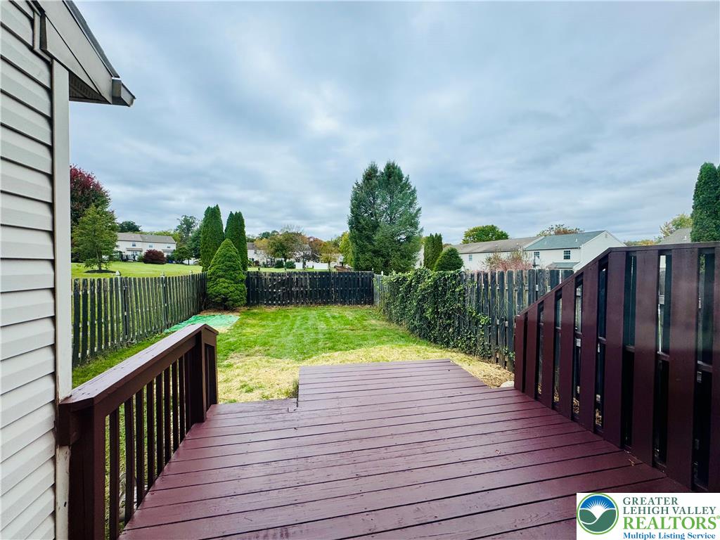 4034 Reeve Drive Bethlehem, PA 18020 - Photo 32 of 36 a view of deck with wooden floor and fence with a garden
