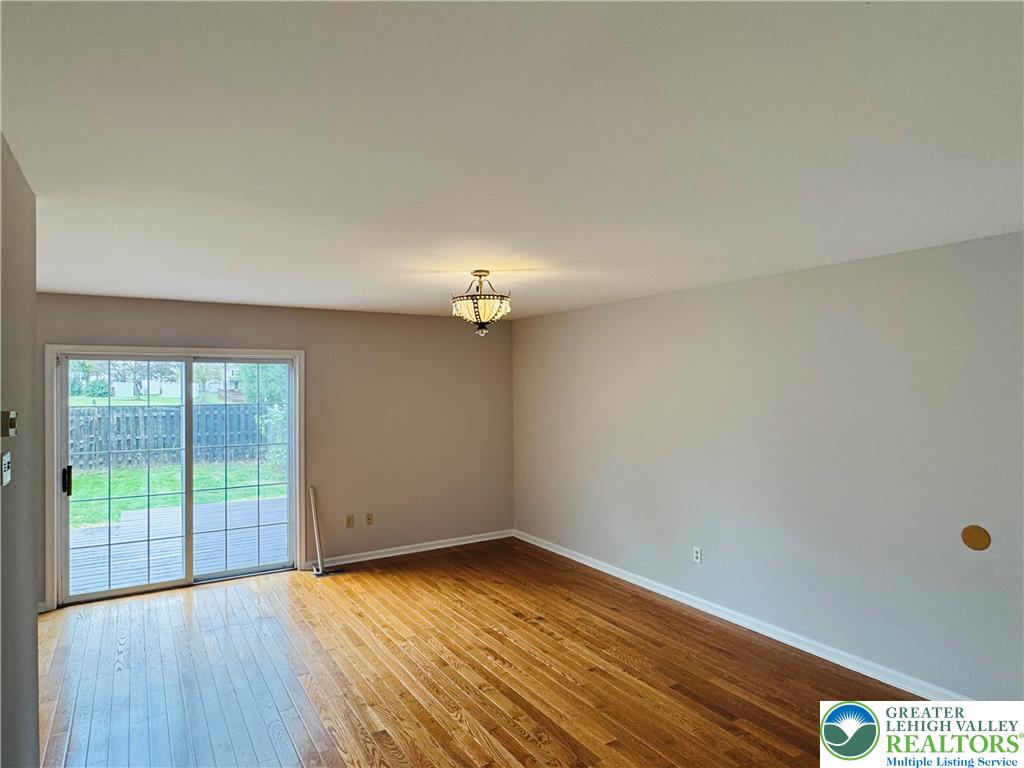 4034 Reeve Drive Bethlehem, PA 18020 - Photo 5 of 36 wooden floor in an empty room with a window