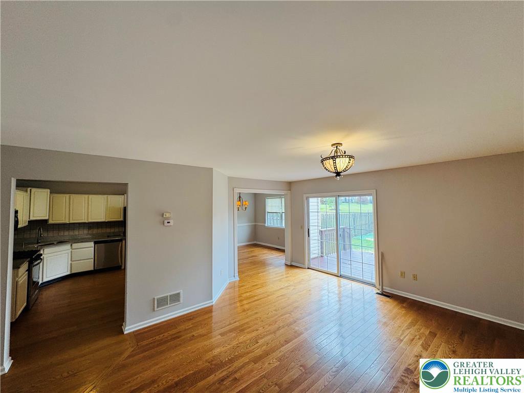 4034 Reeve Drive Bethlehem, PA 18020 - Photo 6 of 36 an empty room with wooden floor and windows