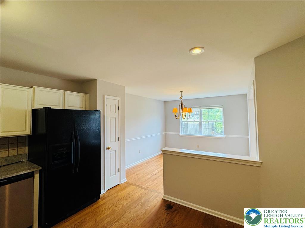 4034 Reeve Drive Bethlehem, PA 18020 - Photo 8 of 36 a view of a kitchen with refrigerator and wooden floor
