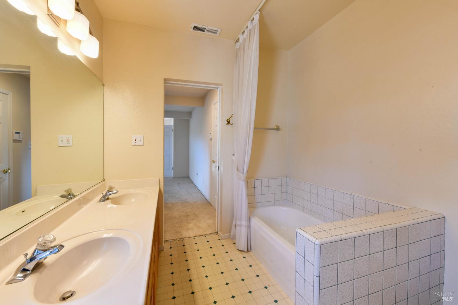 135 Fulton Place Windsor, CA 95492 - Photo 20 of 40 a bathroom with a sink a toilet and shower