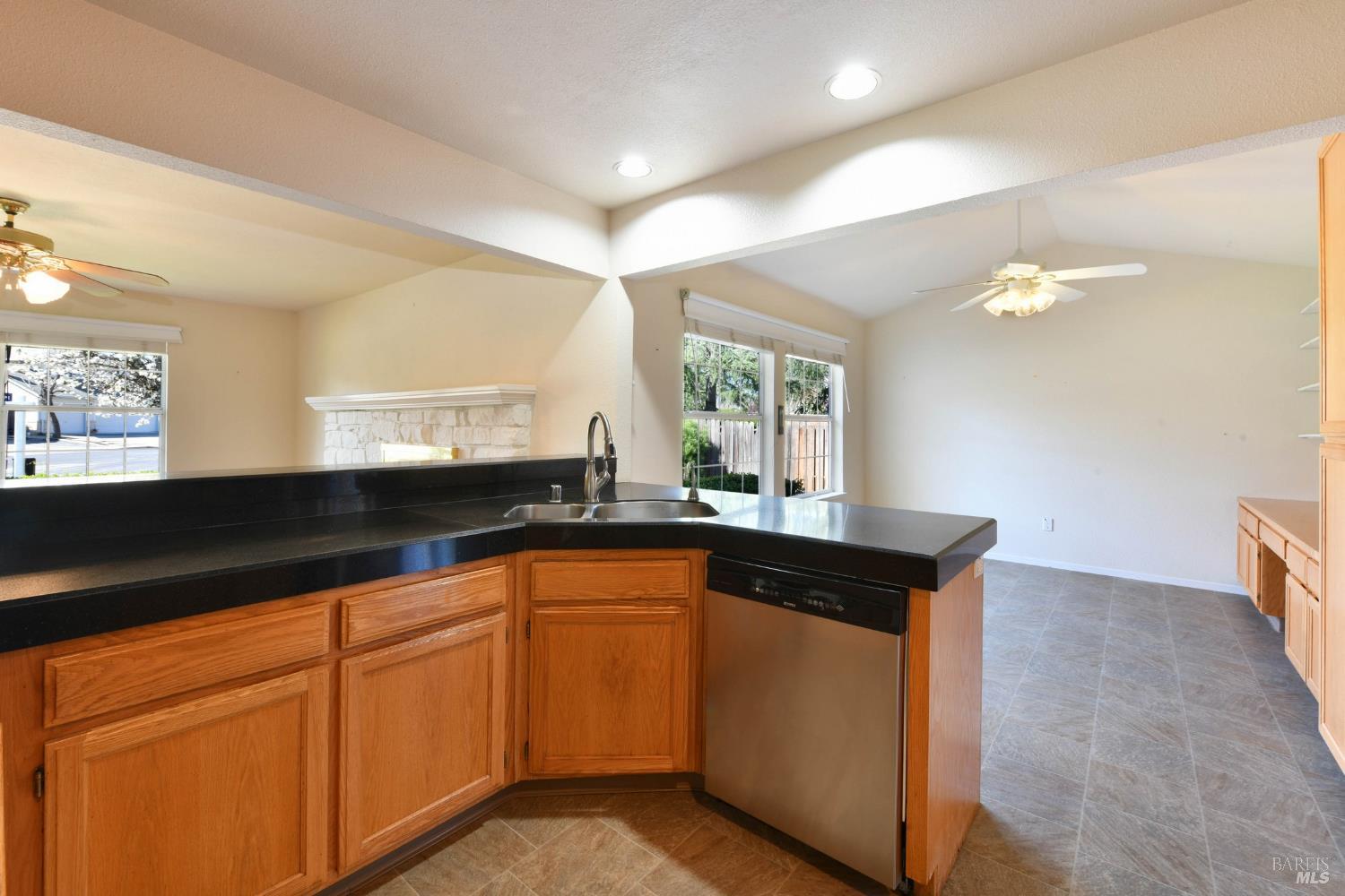 135 Fulton Place Windsor, CA 95492 - Photo 22 of 40 a kitchen with granite countertop a sink and cabinets