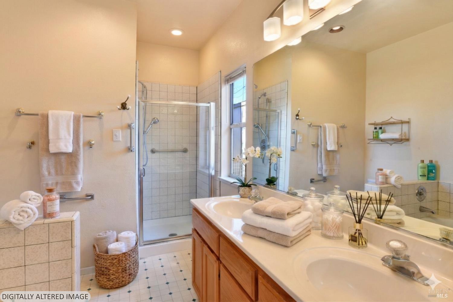 135 Fulton Place Windsor, CA 95492 - Photo 9 of 40 a bathroom with a double vanity sink mirror and shower