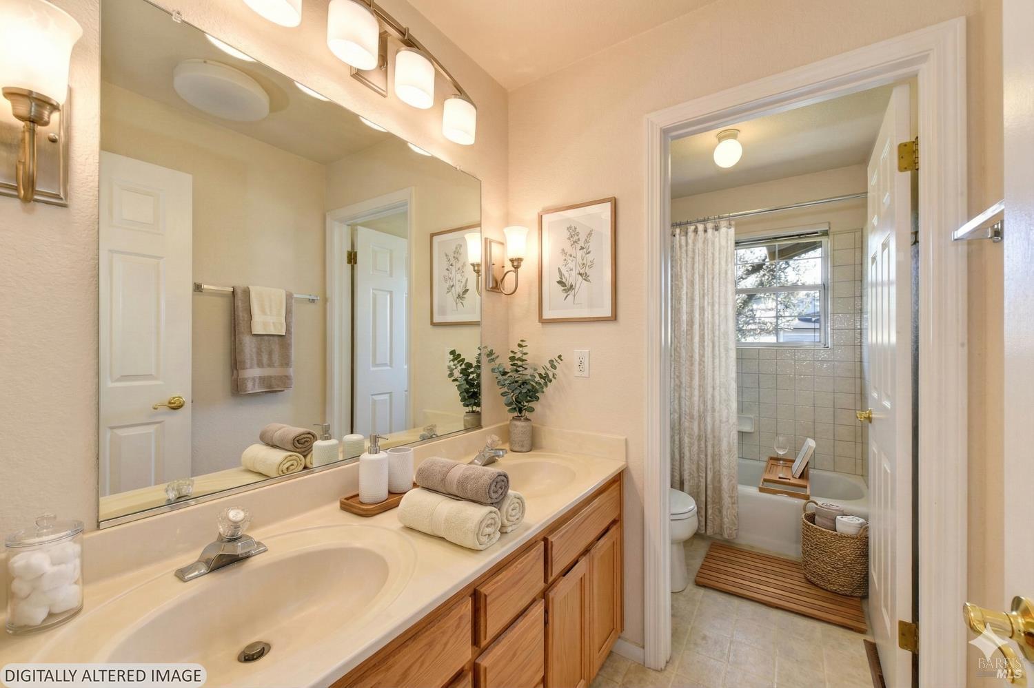 135 Fulton Place Windsor, CA 95492 - Photo 10 of 40 a bathroom with a sink and mirror with toilet