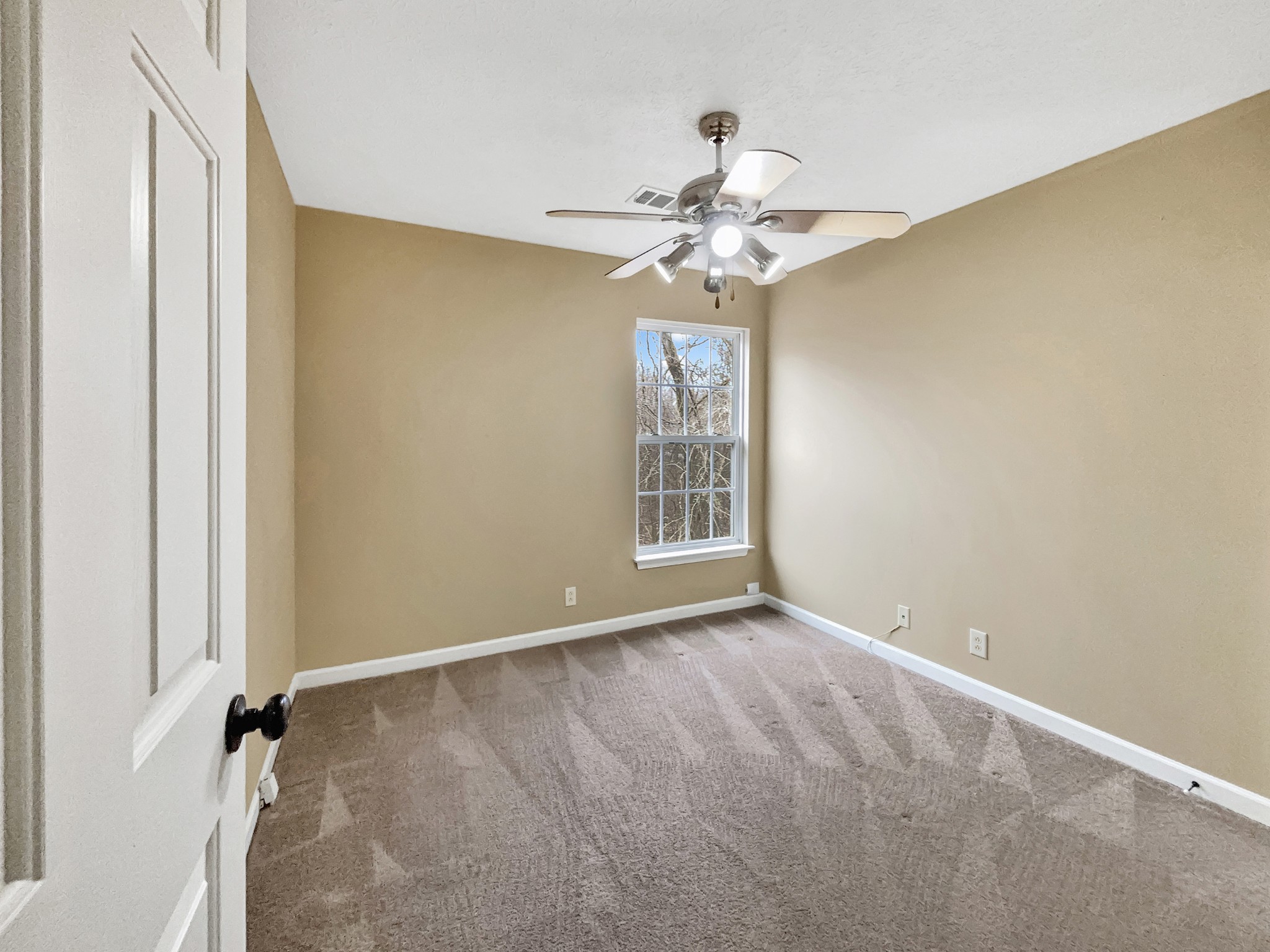 741 Tulip Grove Road, Unit 603 Hermitage, TN 37076 - Photo 11 of 17 an empty room with windows and fan