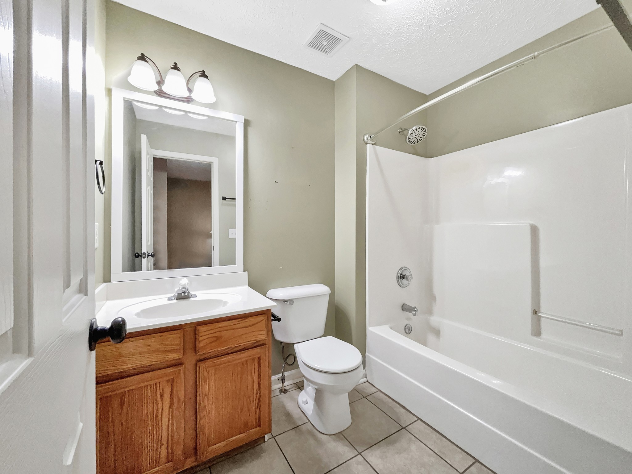 741 Tulip Grove Road, Unit 603 Hermitage, TN 37076 - Photo 13 of 17 a bathroom with a sink a toilet and shower