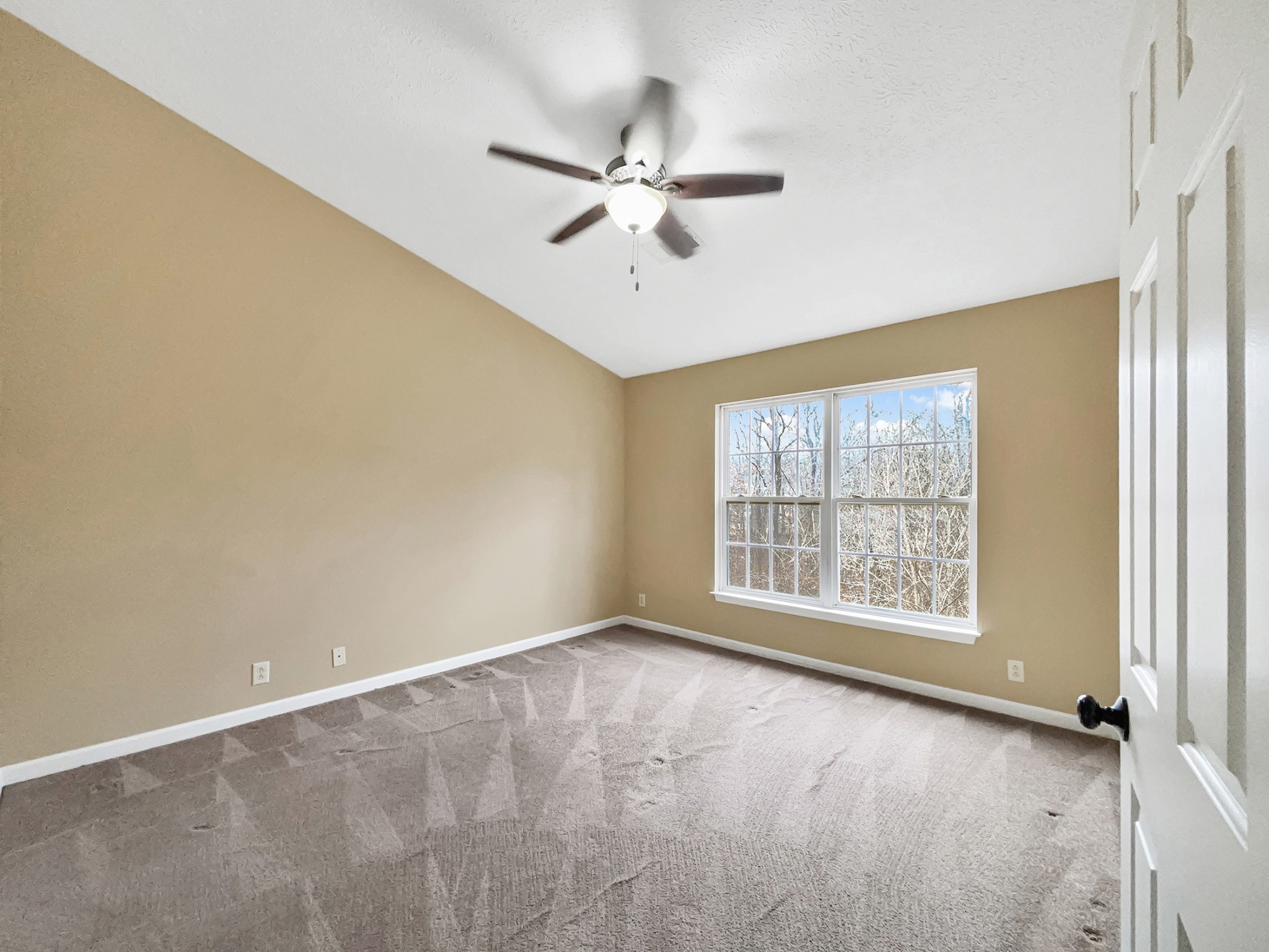 741 Tulip Grove Road, Unit 603 Hermitage, TN 37076 - Photo 4 of 17 a view of an empty room with a window