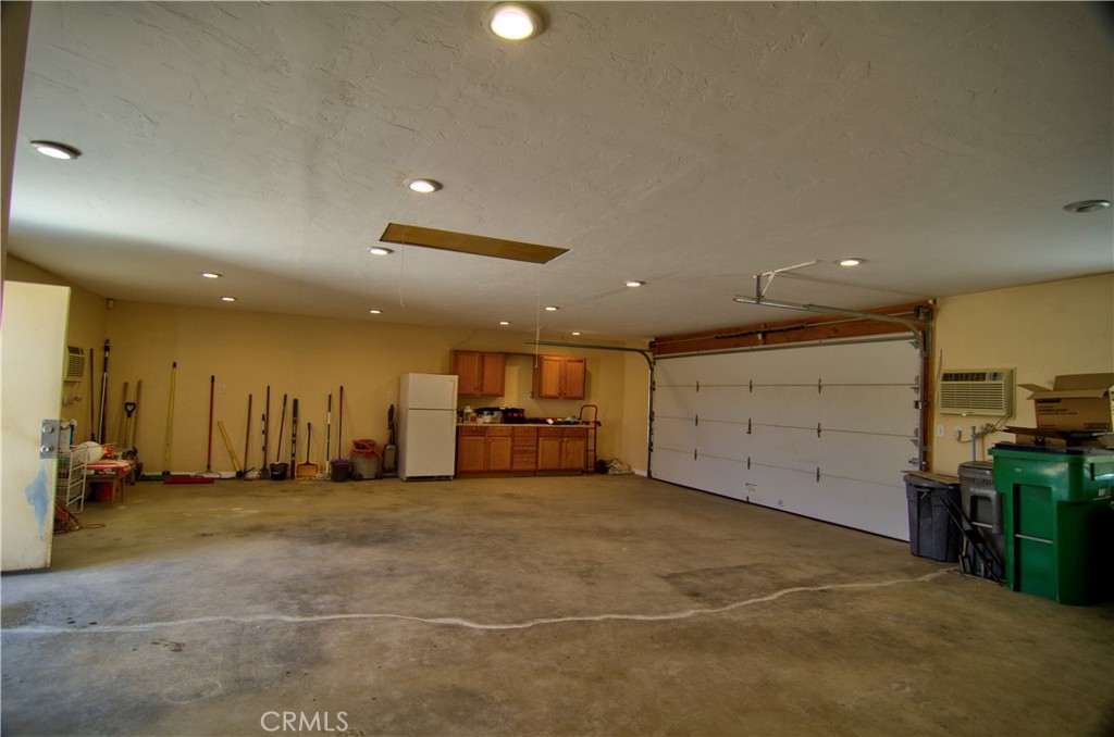 51063 Joshua Tree Road Johnson Valley, CA 92285 - Photo 25 of 35 What person doesn't want a huge garage. There are two 240V wall airc onditioners in the garage that can keep it cool.