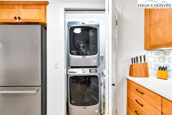 a view of a hallway with washer and dryer