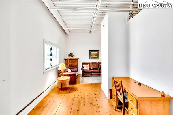 a room with furniture and a window