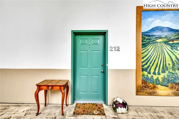 a room with a door and wooden floor