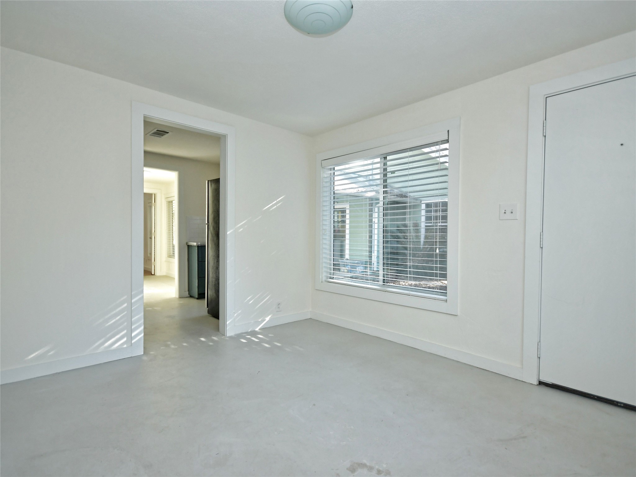4604 Red River Street, Unit B Austin, TX 78751 - Photo 8 of 15 A well-lit area provides a versatile space for dining or a home office.