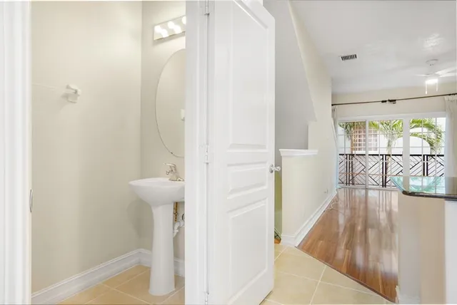 a bathroom with a sink and mirror