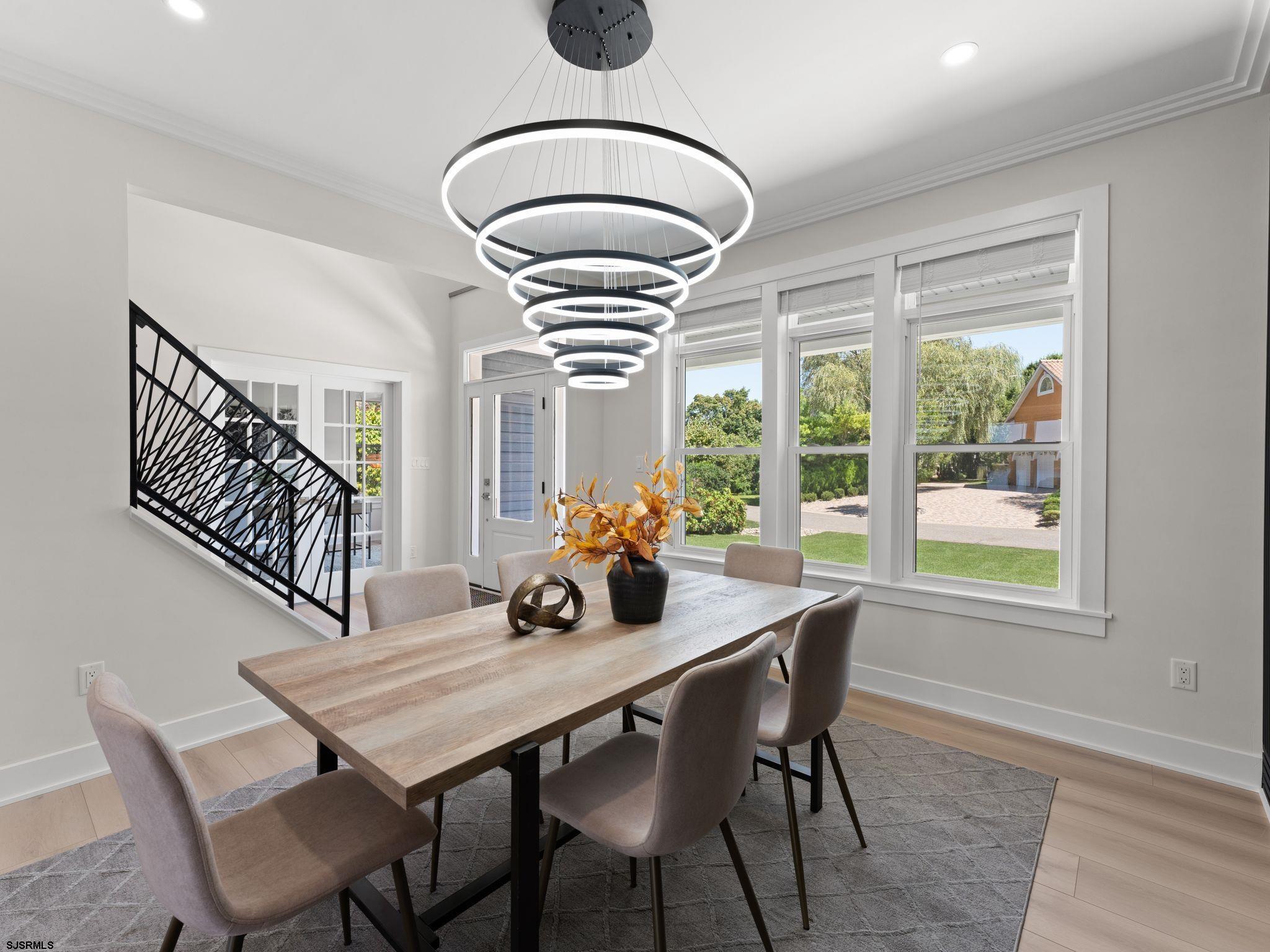 14 Wexford Lane Linwood, NJ 08221 - Photo 14 of 76 a dining room with furniture a chandelier and wooden floor