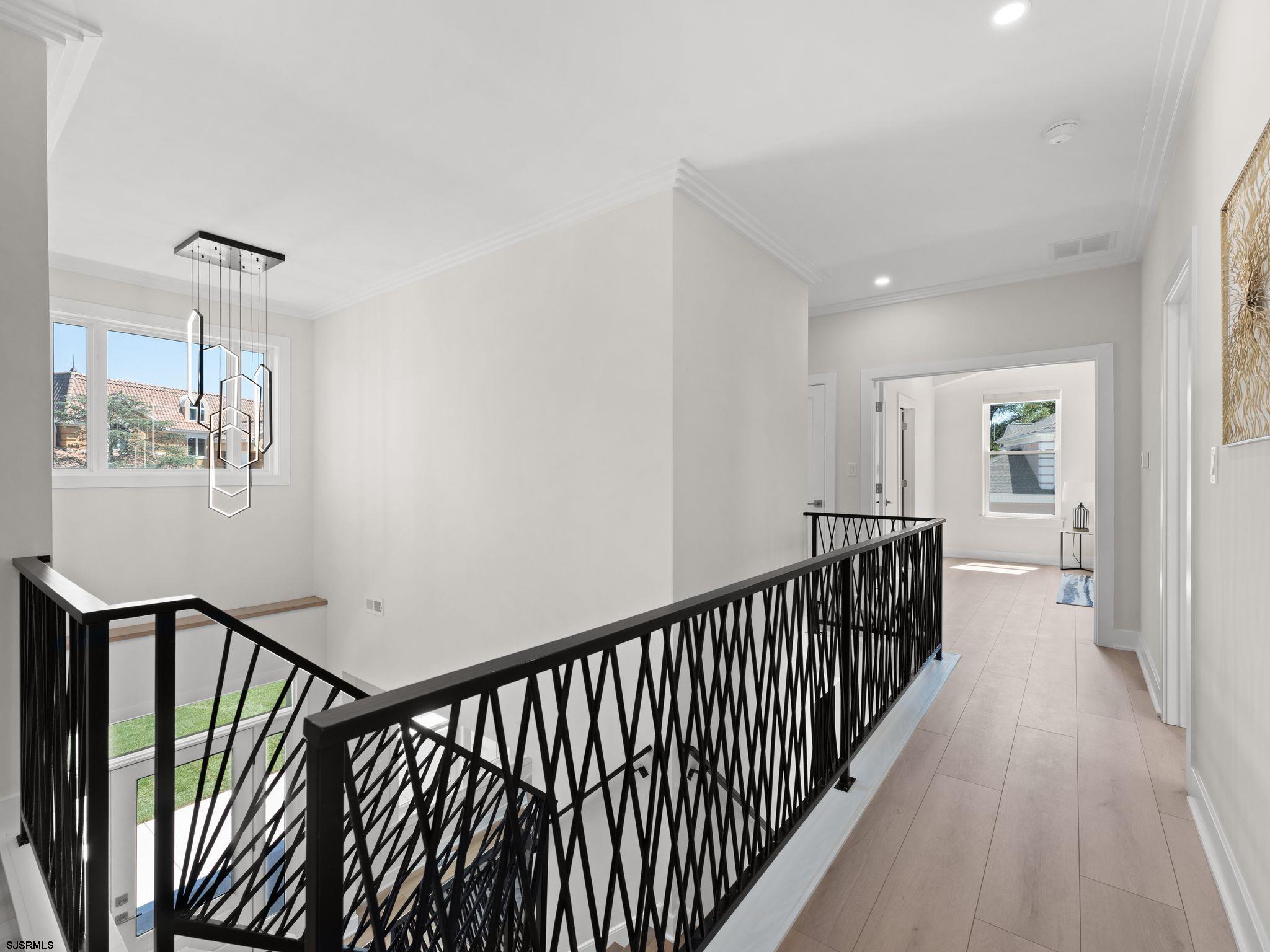 14 Wexford Lane Linwood, NJ 08221 - Photo 40 of 76 a view of a hallway with wooden floor and stairs