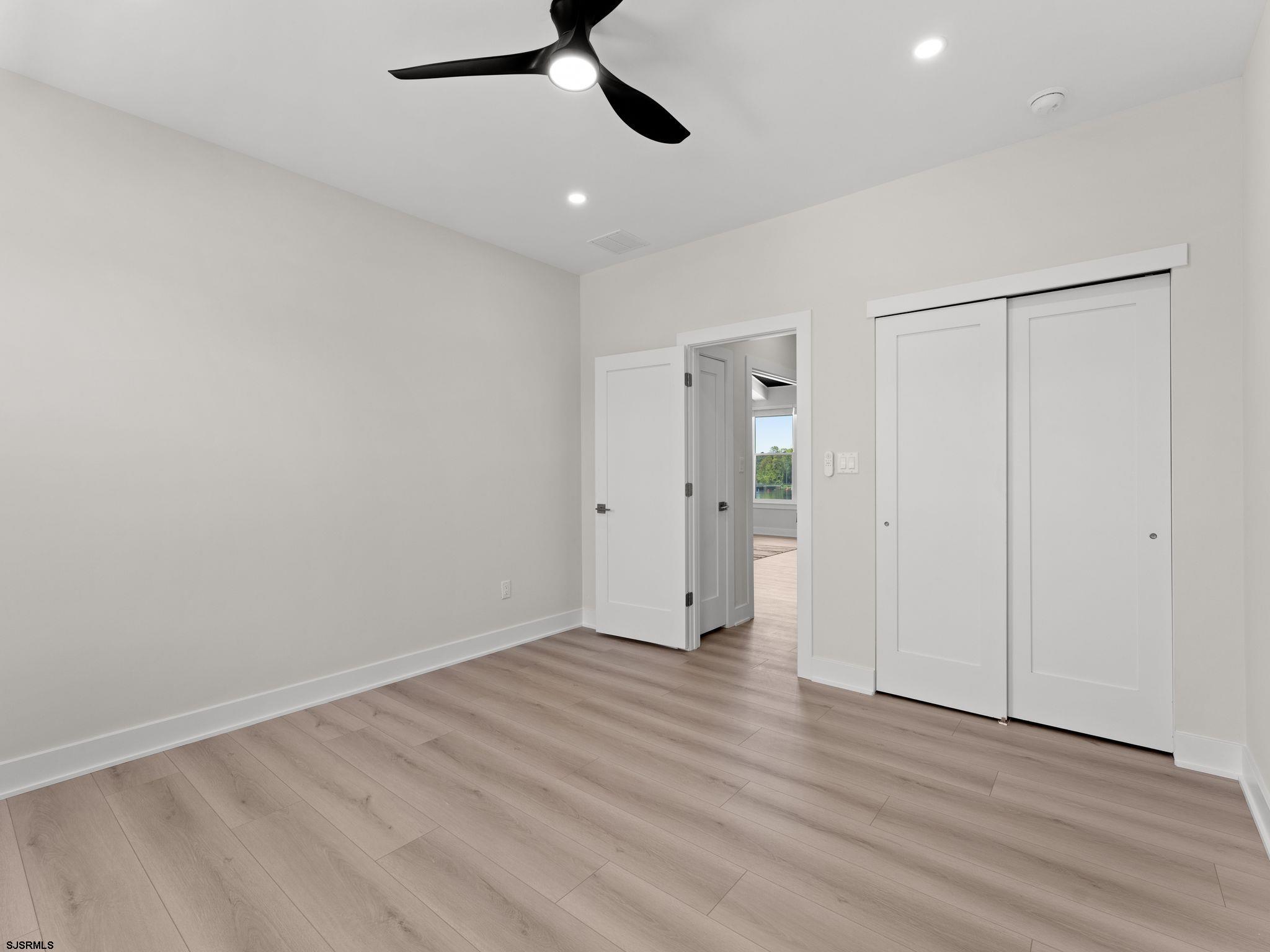 14 Wexford Lane Linwood, NJ 08221 - Photo 42 of 76 wooden floor in an empty room with a window