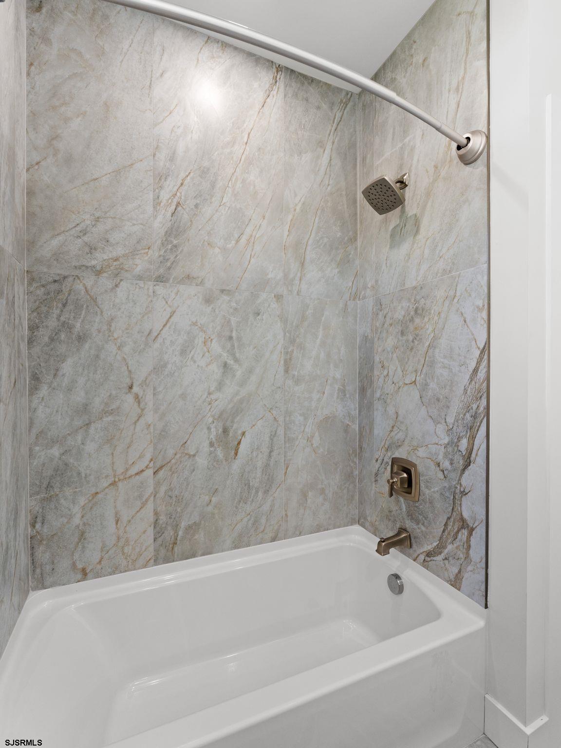 14 Wexford Lane Linwood, NJ 08221 - Photo 44 of 76 a bathroom with a shower and a bath tub