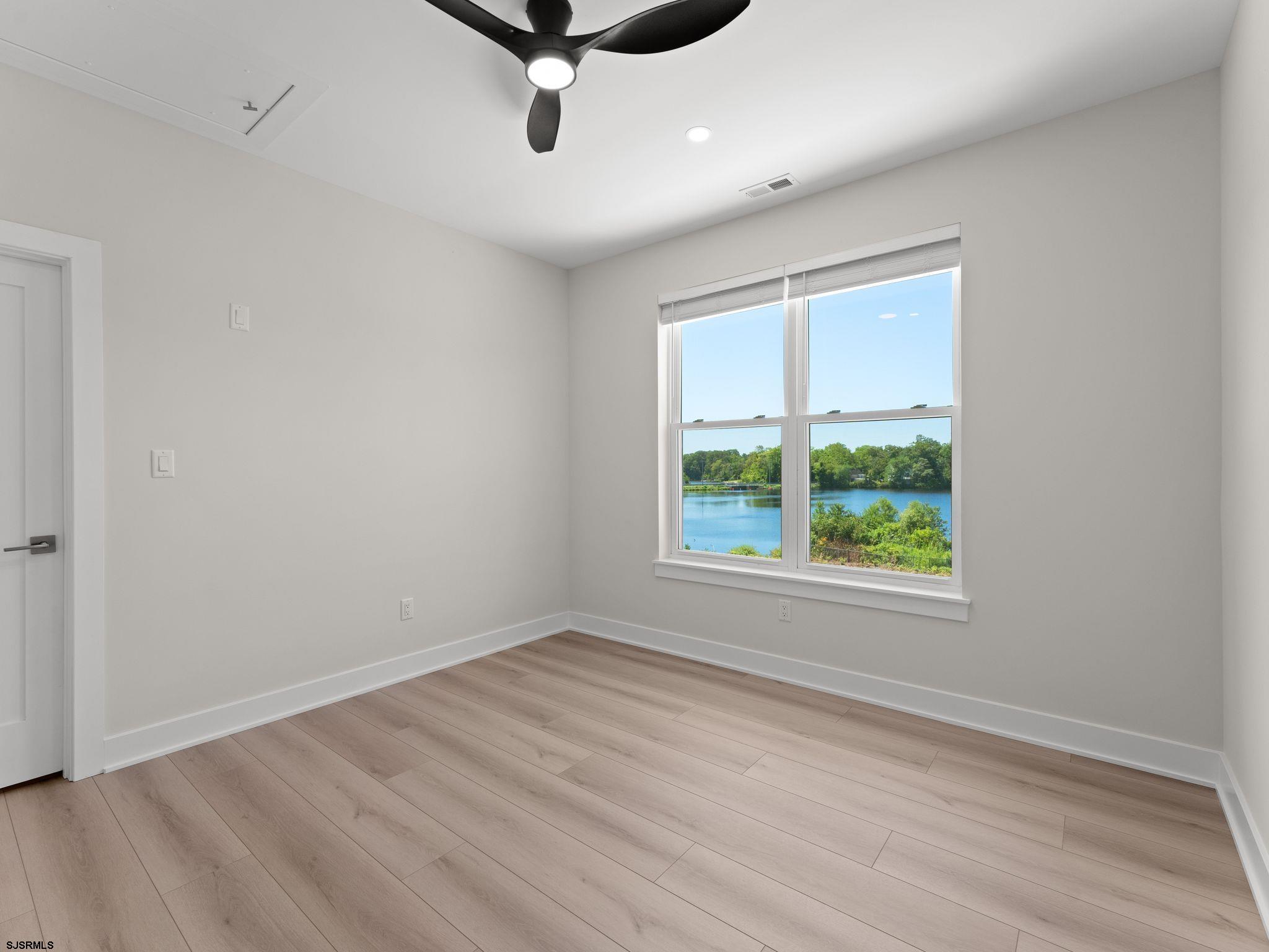 14 Wexford Lane Linwood, NJ 08221 - Photo 45 of 76 wooden floor in an empty room with a window