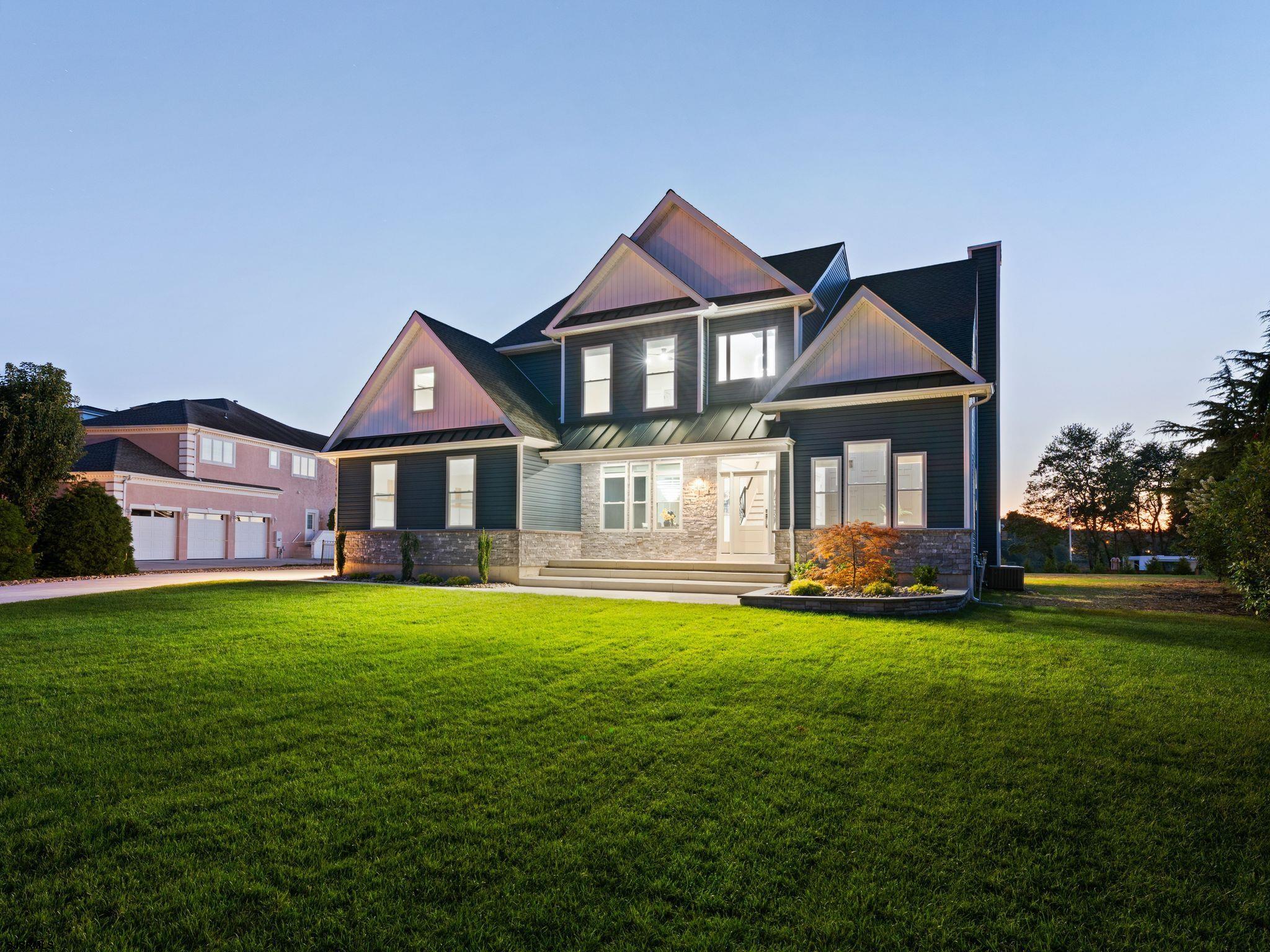 14 Wexford Lane Linwood, NJ 08221 - Photo 6 of 76 a front view of a house with a garden