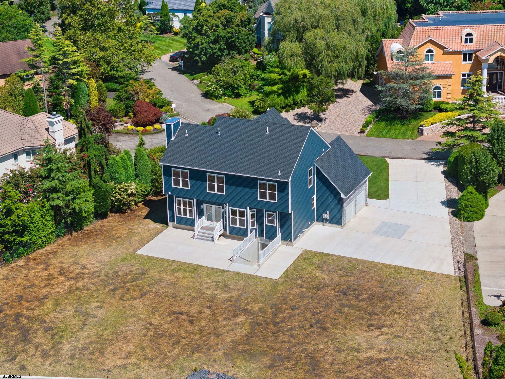 14 Wexford Lane Linwood, NJ 08221 - Photo 69 of 76 an aerial view of a house with swimming pool and large trees