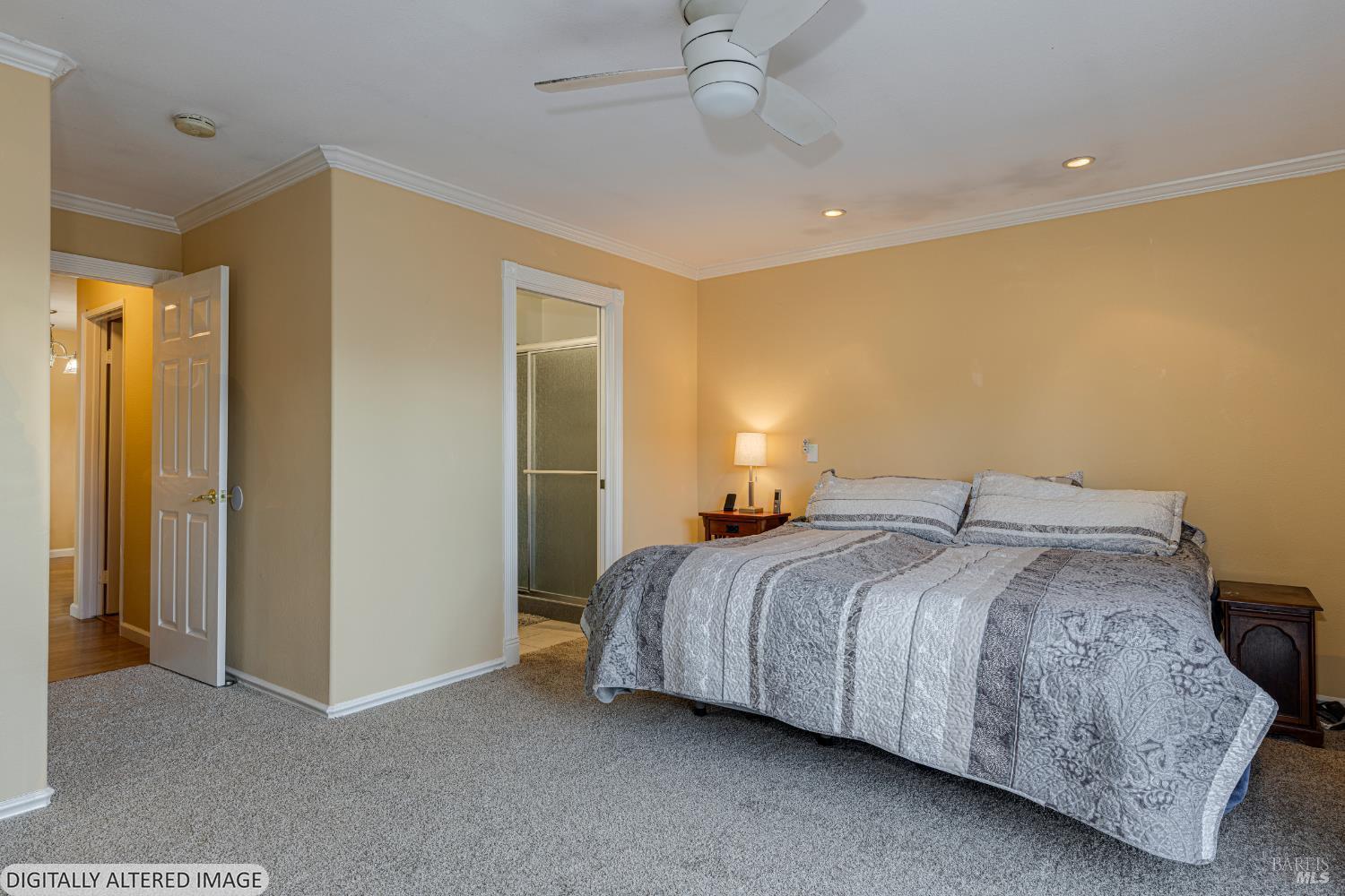 1387 Gillpepper Lane Rohnert Park, CA 94928 - Photo 19 of 36 a bedroom with a bed and a chandelier