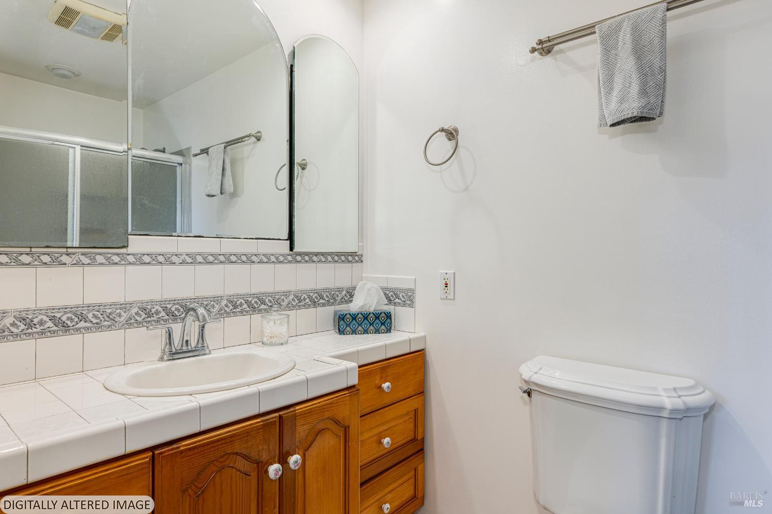 1387 Gillpepper Lane Rohnert Park, CA 94928 - Photo 20 of 36 a bathroom with a sink and a mirror