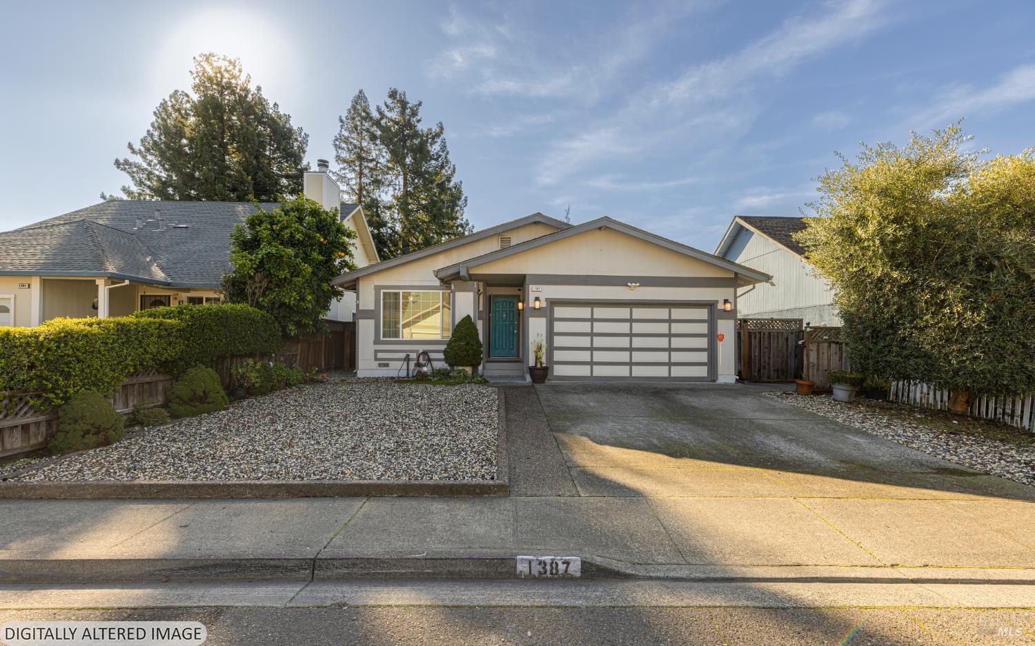 1387 Gillpepper Lane Rohnert Park, CA 94928 - Photo 2 of 36 a front view of a house with a yard and garage